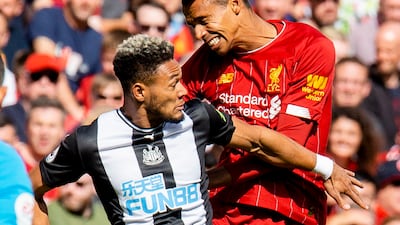Newcastle's Joelinton in action with Liverpool's Joel Matip. EPA
