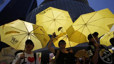 Pro-democracy protesters rally outside of Hong Kong’s legislative council ahead of the electoral reforms package vote.Kin Cheung / AP Photo