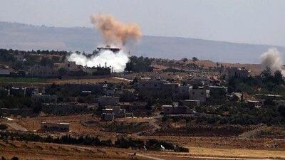 Smoke from artillery shelling rises above the Syrian village of Jbatha Al Khashab, about 45km south of Damascus. The Syrian capital has what analysts believe may be the largest stockpile of chemical weapons in the Middle East.
