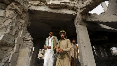 Houthi militants guard the house of Ali Haidar, a Houthi leader, destroyed in an air strike by a Saudi Arabia-led coalition in Sanaa on May 29. Reuters