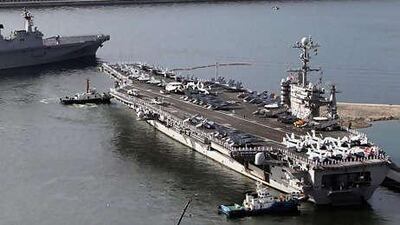 The USS George Washington, a 97,000-ton aircraft carrier from the US 7th fleet, leaves the South Korean naval base in Busan, on the east coast of South Korea.