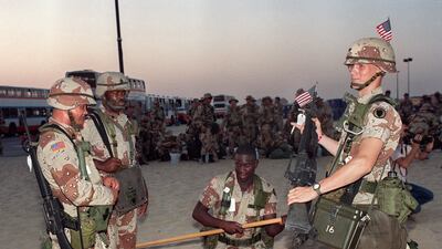 US soldiers of the 3rd Artillery Battalion make preparations in the Saudi Arabian desert a few days after the Iraqi army had entered Kuwait. AFP