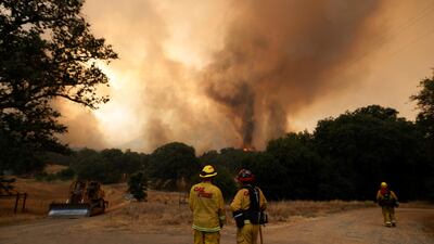 Fire firefighters monitor flames from the Detwiler fire in Mariposa, California. Stephen Lam / Reuters