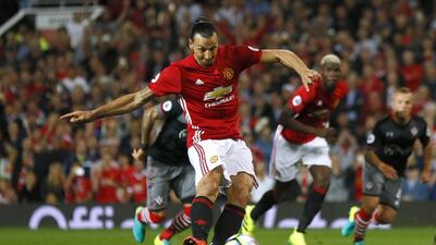 Zlatan Ibrahimovic slots home the penalty to scores his and Manchester United’s second goal. Jason Cairnduff / Reuters