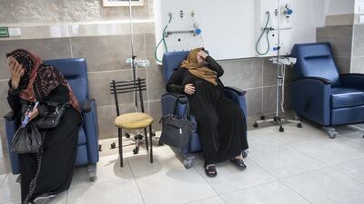 Women wait for their chemotherapy treatment at the oncology department.