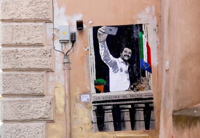 "The dictatorship of the selfie" reads the words across a mural depicting Italian Deputy Prime Minister Matteo Salvini taking a selfie on the balcony over Saffi square. Reuters