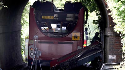 A view of the scene after a bus crashed into a railway bridge on Well House Lane in Winchester, England on Thursday. AP