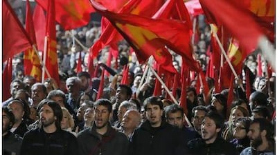 Greek Communist Party's members shout slogans during a protest in Athens Friday. Greece's ruling Socialists were in open revolt against their own prime minister ahead of a confidence vote.