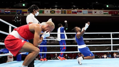 Arlen Lopez of Team Cuba celebrates after winning the gold medal against Benjamin Whittaker (red) of Team Great Britain during the Men's Light Heavy (75-81kg) final.