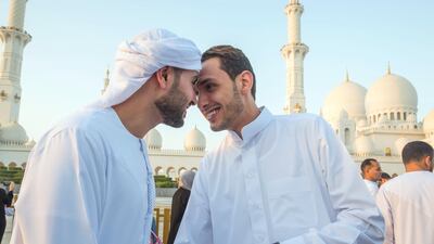 Worshippers celebrate Eid Al Fitr outside Sheikh Zayed Mosque early on Tuesday morning.