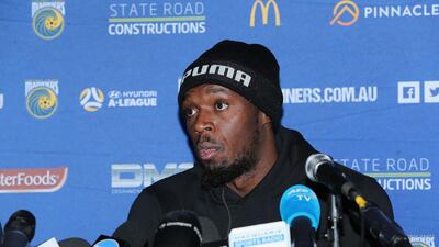 Usain Bolt speaks at the press conference after his first training session. Getty Images