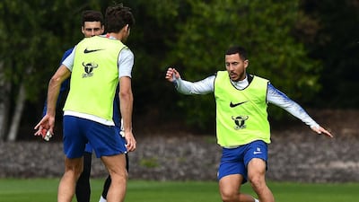 Chelsea's Belgian midfielder Eden Hazard, right, takes part in a training session. AFP