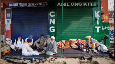 Protesting farmers eat a meal at the border between Delhi and Haryana state. Talks between protesting farmers and the Indian government failed Tuesday after both the parties could not reach a common ground. AP