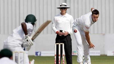 South Africa bowler Morne Morkel, right, delivers the ball on Day 4 of the one-off Test match against Zimbabwe at Harare Sports Club on August 12, 2014. Jekesai Njikizana / AFP
