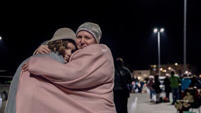 Ira, 45, and her daughter Olena, 12, outside a transit centre in Przemysl, Poland. Photo: Adrienne Surprenant