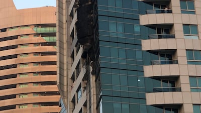 The building was left charred on least eight floors on the marina side. Nicholas Webster / The National