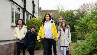 Ukrainian refugees children arrive at a primary school in Cambridgeshire with their mother after being offered sanctuary in the UK. PA