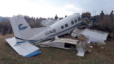 A small plane operated by Kasthamandap Airlines is seen on a field after it crashed in Kalikot, Nepal, February 26, 2016. REUTERS/Khagendra Bhattarai EDITORIAL USE ONLY. NO RESALES. NO ARCHIVE