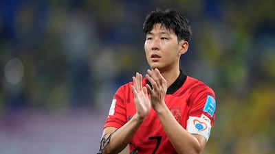 Son Heung-min applauds the fans after South Korea's defeat to Brazil in the World Cup last 16. AP
