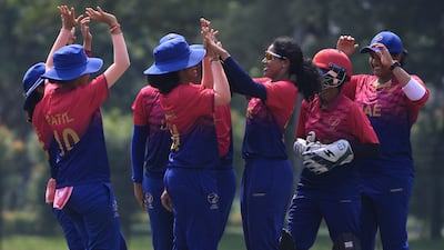 UAE players celebrate the wicket of Hong Kong opener Natasha Miles