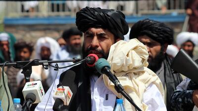 Haji Mohammad Yousaf, the Taliban's governor for Kandahar province, talks to supporters during a ceremony in Kandahar, Afghanistan. EPA