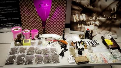 Police confiscated marijuana plants from a man's home in Abu Dhabi, where they also found more than 600g of the drug and cannabis seeds. Courtesy Abu Dhabi Police