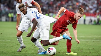 Liverpool's Harvey Elliott looks to wriggle past the Lyon defence. AFP