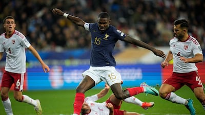 France's Marcus Thuram, centre, about to take a shot against Gibraltar. AP