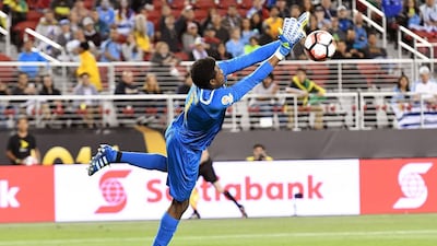 Goalkeeper Andre Blake of Jamaica dives to make a save against Uruguay. Thearon W Henderson / Getty Images