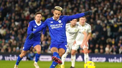 Callum Robinson scores Cardiff's second goal from the penalty spot. PA