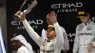 Lewis Hamilton salutes the crowd after winning the Abu Dhabi Grand Prix, although his victory was not enough for him to retain his drivers' championship title. Mohammad Al Shaikh / AFP