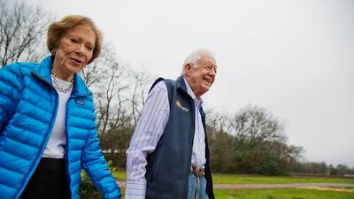 Former president Jimmy Carter and wife Rosalynn arrive for a ribbon-cutting ceremony for a solar panel project in 2017. AP