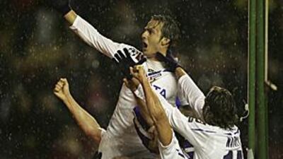 Fiorentina's Alberto Gilardino, top, celebrates after scoring the winner against Liverpool at Anfield.