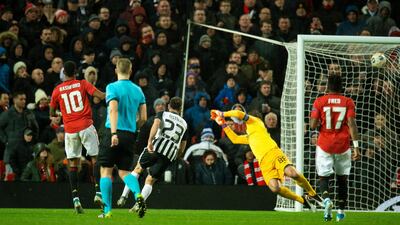 Marcus Rashford scores United's third. EPA