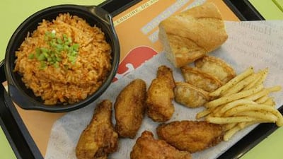 The crispy wings combo with kimchi fried rice at Bon Chon Chicken in Dubai.