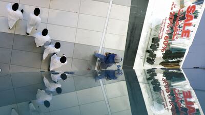 People walk at The Avenues, Kuwait's biggest shopping mall, in Kuwait City. AFP