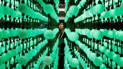 Soyoung Han looks at a display representing LG super UHD TV Nano Cell displays at the Consumer Electronics Show in Las Vegas. John Locher / AP