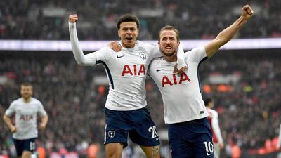 Tottenham Hotspur's Harry Kane, right, celebrates scoring a goal with teammate Dele Alli against Arsenal at Wembley Stadium, London. Neil Hall / EPA