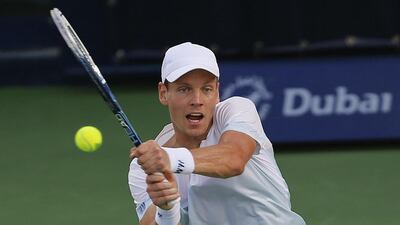 Tomas Berdych of Czech Republic returns the ball to Sergiy Stakhovsky of Ukraine at the Dubai Tennis Championships on Wednesday, February 26, 2014. Saleh Salem / Reuters