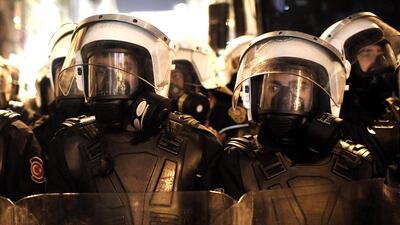 Turkish riot police stand guard during a demonstration in Istanbul, Turkey on December 27, 2013. The Turkish government has reassigned 16 more police chiefs following an anti-corruption probe which the prime minister, Recep Tayyip Erdogan, says in targeting his government. Sedat Suna/EPA