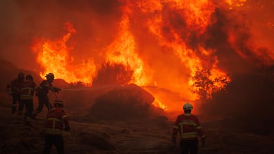 Firefighters battle a forest fire near the village of Galegos da Serra in the municipality of Vila Real, Portugal. EPA