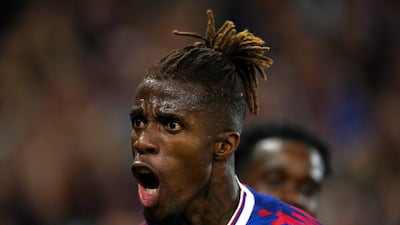 Crystal Palace's Wilfried Zaha celebrates scoring the opening goal against Brentford at Selhurst Park. PA