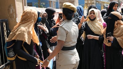 Students wearing hijabs protest outside their government-run school in Bengaluru, the capital of India's Karnataka state, on February 17. AP Photo