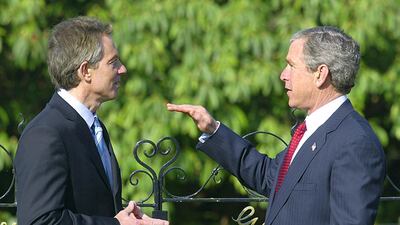 US President George W. Bush speaks with British Prime Minister Tony Blair, 08 April 2003 at Hillsborough Castle in Northern Ireland where they met to discuss issues in relation with Iraq. AFP