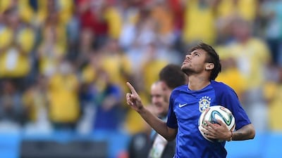 Neymar shown prior to Thursday night's kickoff to the 2014 World Cup. He scored twice in Brazil's 3-1 victory over Croatia. Vanderlei Almeida / AFP / June 12, 2014