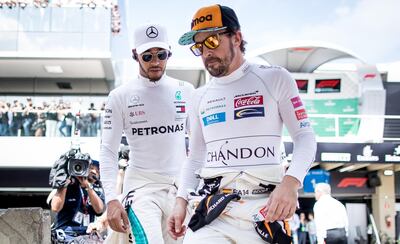 Fernando Alonso and Lewis Hamilton walk to the grid before the 2018 Brazilian Grand Prix. The pair proved combustible teammates during their time together at McLaren. Getty Images