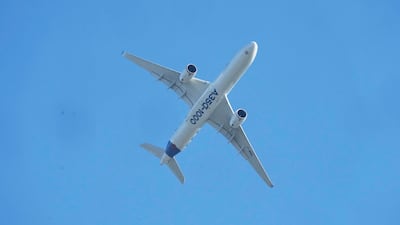 An Airbus A350-1000 in the sky above the Paris Air Show in Le Bourget, north-east of central Paris. AP