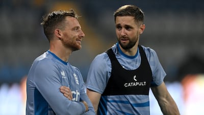 England captain Jos Buttler, left, speaks with Chris Woakes during a nets session at Wankhede Stadium on October 19, 2023 in Mumbai. Getty
