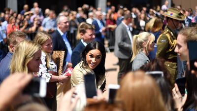 Meghan smiles as she meets with people outside the Sydney Opera House. AFP