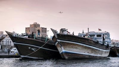 Crews load and unload goods and cargo near Deira Spice Souq in Dubai. For many people, the Creek with its dhow moorings, abra and souqs is the essence of old Dubai - the city's original trading centre that remains a symbol of early commerce in today's busy metropolis. Reem Mohammed / The National